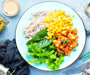 Cooked winter root vegetables including sweet potatoes, squash, and lentils prepared as a fiber-rich seasonal meal