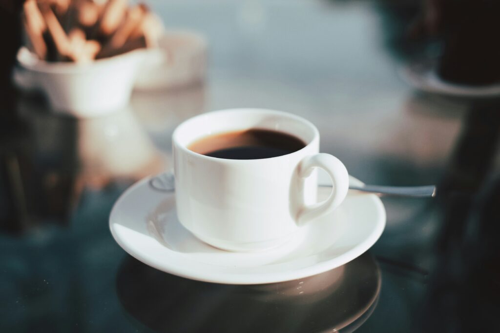 A cup of coffee, representing caffeine's effect on sleep