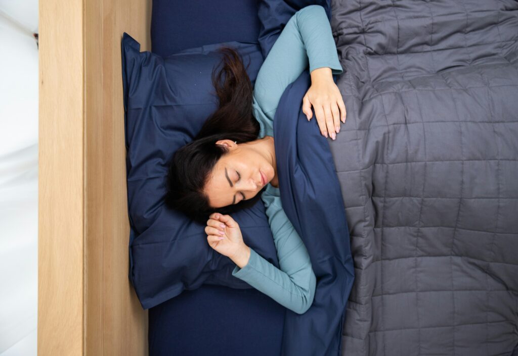 person sleeping representing integrative health services and sleep optimization at Well Rooted Health